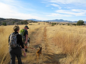 Andrea and Jerry hiking across Meadow Valley on AZT Passage 3.