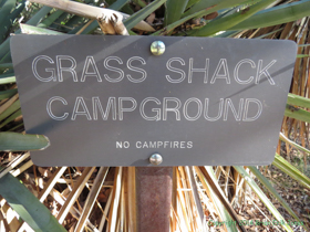 Grass Shack Campground sign.