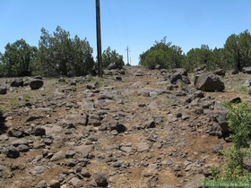 Passage 26 heads up this extremely rocky powerline trail.