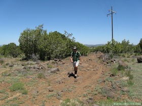 Brian hiking up the powerline section of Passage 26.