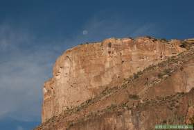 The moon over a cliff in Aravaipa Canyon