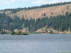 A house on Seeley Lake with a four boat garage.