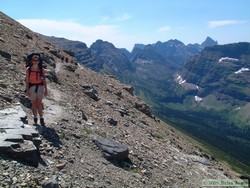 Shan getting blown about on the long traverse between Dawson Pass and Cut Bank Pass.