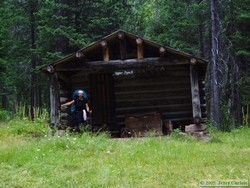 Andrea in front of the Nyack Creek Patrol Cabin.