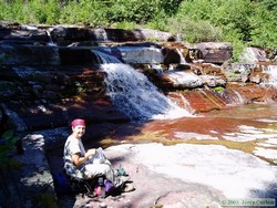 Andrea enjoying lunch at the un-named falls on the un-named creek.