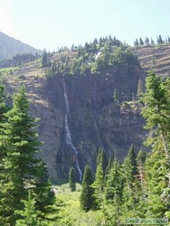 A towering waterfall coming off of Medicine Grizzly Peak.
