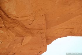 Pictographs in a seemingly impossible location way out at the edge of a large overhang roughly 70 feet above the ground.
