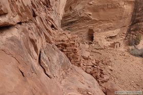 Ladder platforms (center) precariously poised on the rock face at Junction Ruin in Grand Gulch.