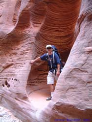 Jeff in an alcove carved out of the canyon wall in Buckskin Gulch