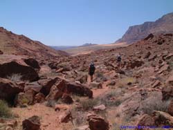 Shannon and Jeff navigate a rocky, sandy overland trail.