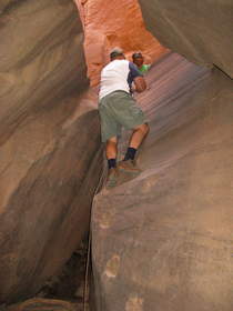 Chuck descending the Boulder Choke in Buckskin Gulch.