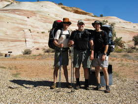 Steve, Chuck and Brian sport their lower leg mud patina after completing a backpacking trip in Paria Canyon.