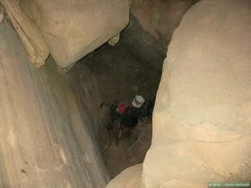 Brian at the bottom of the boulder choke relaying packs.