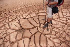 Chuck walking on thick mud cracks in Upper Buckskin Gulch.