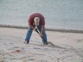 Chuck digging for crabs.  (Please note beer can close at hand.)