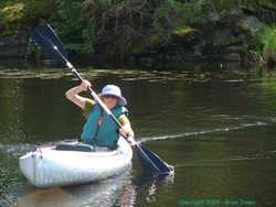 Shan paddles the kayak around solo.
