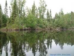 The water was smooth as silk and reflected all the wide sky.