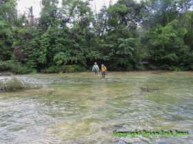 Shannon and Jose fording a stream on the way to Yok Baluum Cave.