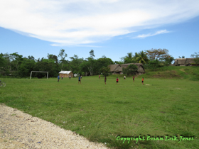 Kids playing soccer in the village of Santa Cruz