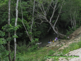 Two women in Santa Cruz washing clothes in the creek