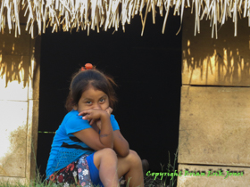 One of Jose's daughters guardedly eyes us as we talk with Jose while waiting for Bruno to pick us up