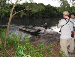 Shannon helping Fernando beach the boat so we could get back on after he navigated up the rapids.