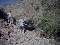 Ron makes his way over the rock slide.