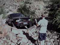 Ron makes his way over the rock slide.