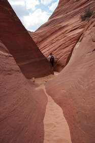 Steve exploring a sculpted sandstone wash in Coyote Buttes North.