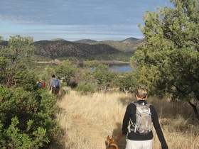 Raquel, Shaun and Cheetah hike by Parker Canyon Lake near the beginning of AZT Passage 2.