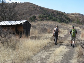 Andrea and Jerry approaching another cabin on 'The Old Keebler Ranch' on AZT Passage 3.