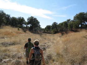 Jerry and Andrea hiking in the Cott Tank Exclosure on a side trip from AZT Passage 3.