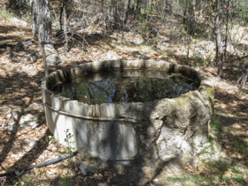 A mineral encrusted wooden holding tank at Bear Spring.
