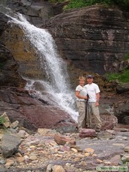 Jerry and Andrea posing by the large waterfall at Beaver Woman Lake.