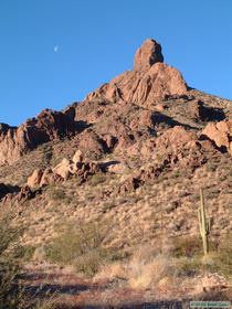 An afternoon moon over a spire in Tunnel Springs Canyon.