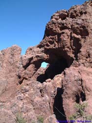 An arch at the top of Arch Canyon marks the beginning of the descent