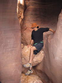 Steve descending a boulder choke in Wire Pass.