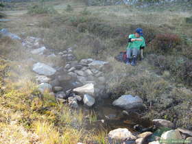 Steve getting ready to filter water at a stream flowing in to Pecos Baldy Lake in the Sangre de Cristo Mountains.