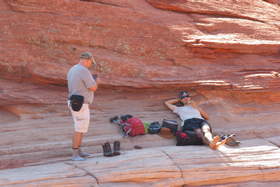 Chuck and Steve relaxing at The Wave in Coyote Buttes North.