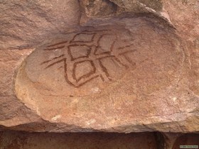 A turtle pictograph in a curved depression in Valle Montevido.