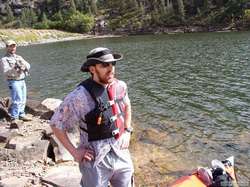 Eyeing the weather while a fisherman checks out my stylish kayaking attire.