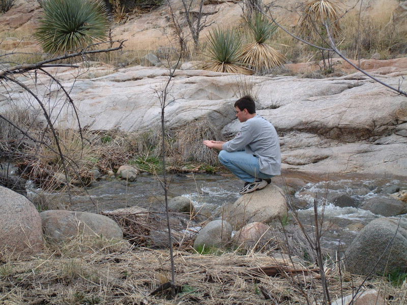 Winch has a Zen moment on a rock in the middle of Canada del Oro creek.