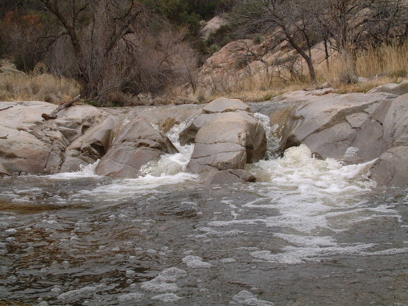 Parallel incised waterfalls through bedrock on Canada del Oro creek.